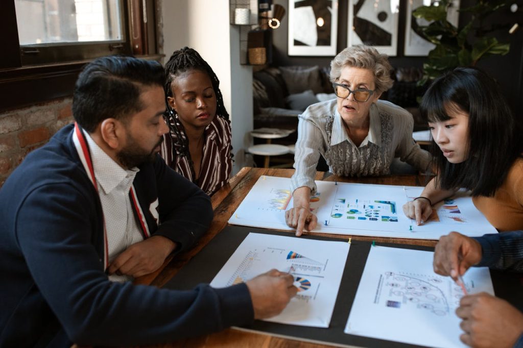 Diverse financial institution team discussing digital solutions for inclusive finance