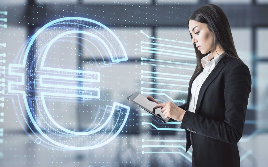 Businesswoman using digital tablet with Euro symbol, representing core banking software and digital finance solutions.